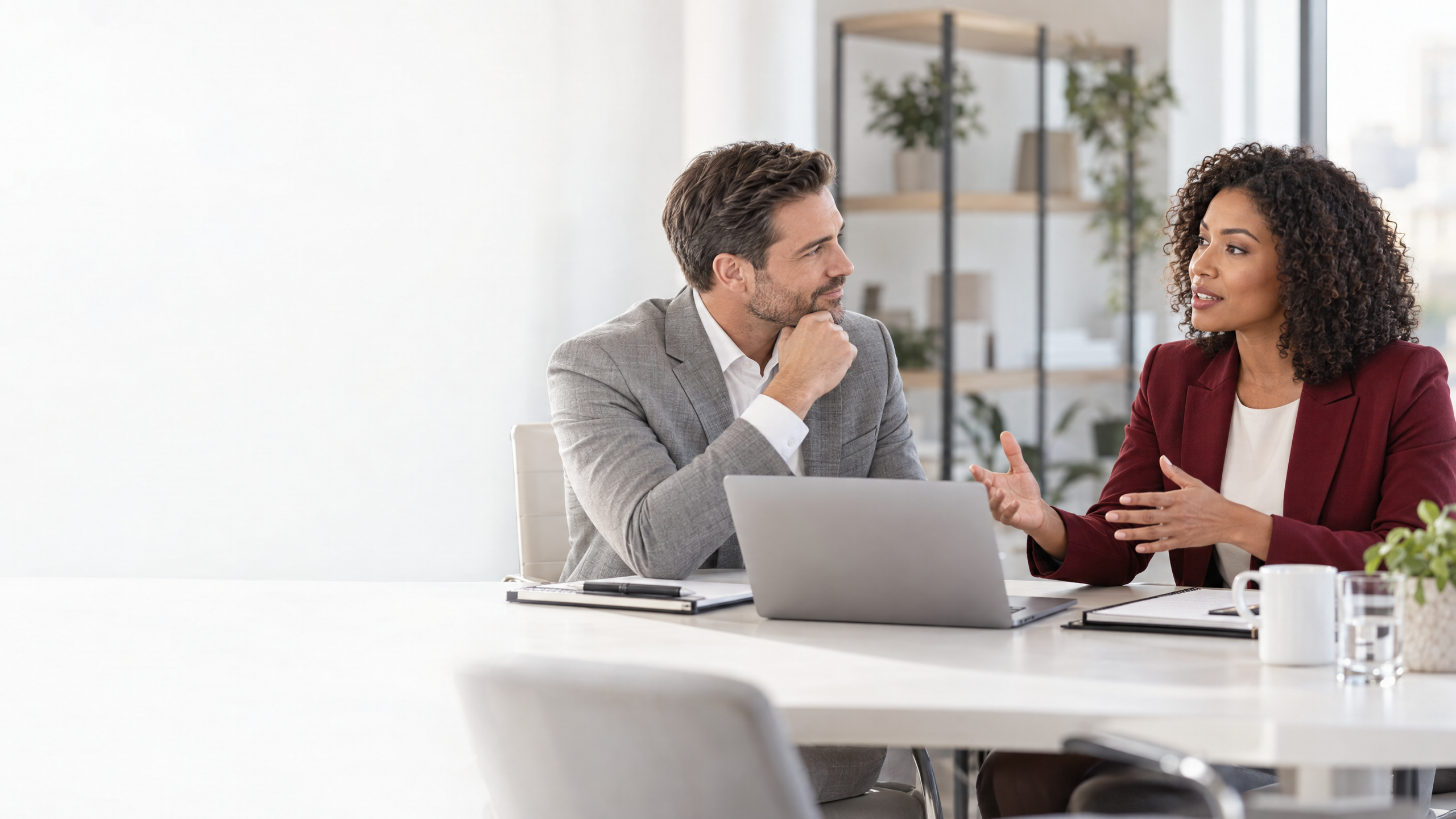 Recruiter and business leader discussing temporary staffing and direct hire options